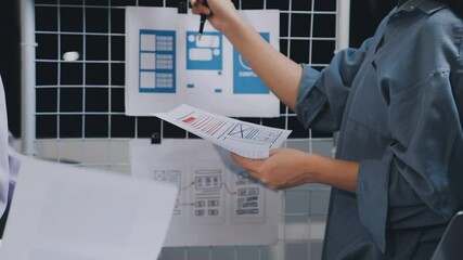 Website designer, Creative planning phone app development template layout framework wireframe design, User experience concept, Young asian woman UX designer working on smartphone application at office