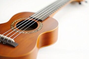 Fototapeta premium Close-up of a wooden ukulele on a light background.