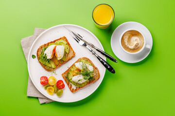 Delicious avocado toasts topped with perfectly cooked poached eggs