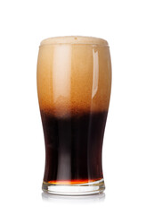 A tall glass of dark stout beer with frothy head, isolated on a clean white background