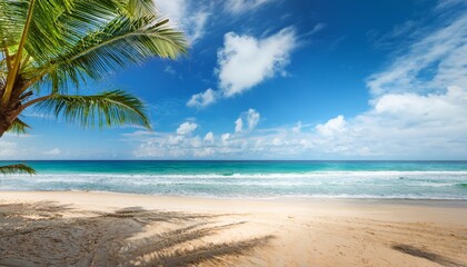 Obraz premium coconut palms swaying on sandy beach under bright blue sky with clouds and ocean waves creating a tropical paradise atmosphere