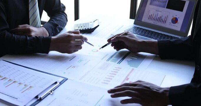Business team brainstorming and discussing with financial data and report graph. Accounting company Teamwork meeting working concept.
