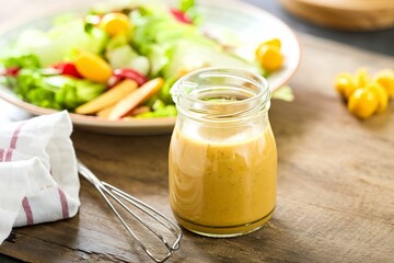 Homemade honey mustard salad dressing in a jar