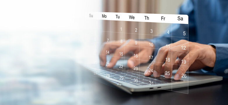 Businessman manages time for effective work. Calendar on the virtual screen interface, Businessman paste Post-it on important days on the calendar Important appointment dates