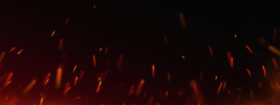 Burning hot sparks and glowing embers fly up. Fiery abstract background with bright red fire particles on black. Bonfire flames, fireworks, heat or welding sparks with dark dramatic atmosphere.