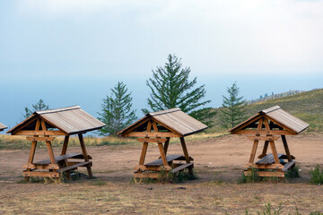 Three similar wooden gazebos, small gazebo in tourist place