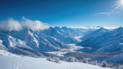 Breathtaking panorama of the snowy mountains and valley on a bright winter day. Cold winds sweep across the high peaks. Expansive view of the snow-draped mountain range.
