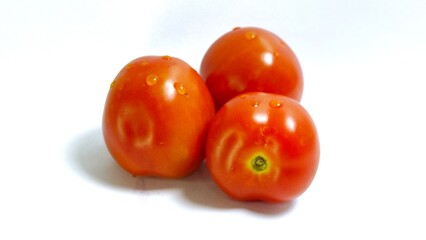 Tomato isolated. Tomato on white background. Healthy tomatoes ready to eat
