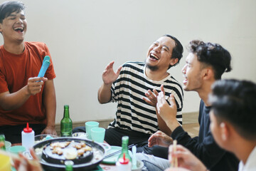 Male Friends Having Fun Laughing Together Sharing Story While Celebrating a BBQ Party