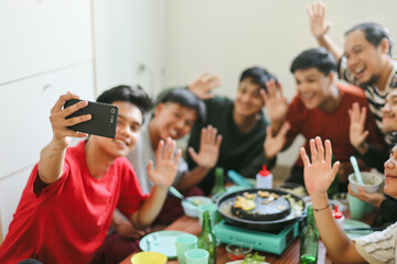 Group of Asian Friends Taking Selfie at Barbecue Dinner Time Using Smartphone