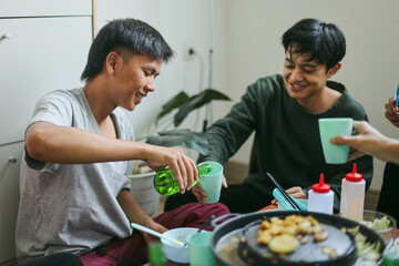 Man Pouring Beer to His Friend, Having Fun at Barbecue Party