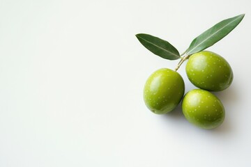 Obraz premium green olives with leaves on white background