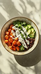 Vibrant Roasted Sweet Potato Quinoa Bowl with Avocado, Black Beans and Creamy Cilantro Dressing A Delicious and Healthy Meal Prep Idea