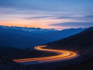 Winding road light trails at twilight