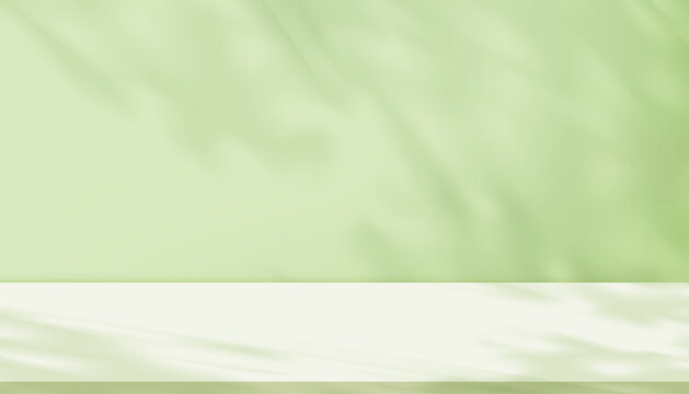 Shadow leave and blur gradient light on green studio background wall room and podium stage for product,Summer or Spring banner green pastel with abstract sunlight on floor texture