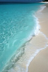 Turquoise Waves on White Sand Beach.