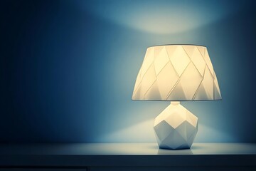 Fototapeta premium Lit lamp on a shelf with a white faceted base shines in the dark interior