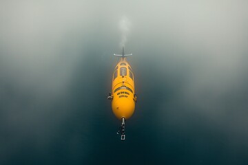 Obraz premium Yellow Submersible Exploring Deep Ocean.