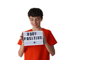 body positive in children and adolescents concept. preteen boy holding a sign with a message