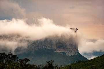Cloud-covered mountain peak at sunset in Chapada Diamantina.