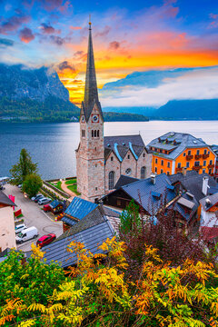 Hallstatt, Austria, Salzkammergut region: Misty autumn scenic morning view of Hallstatter See or Lake Hallstatt and the old town church in world famous alpine village in Upper Austria, Europe