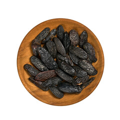 flat lay top view pile of tonka bean in wood bowl cutout