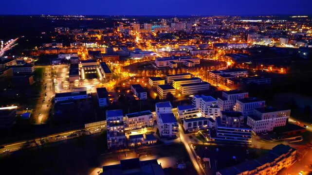 Regional Chamber of Agriculture of Brittany at night, Bourg-l'&Eacute;vesque - la Touche - Moulin du Comte, Rennes in France. Aerial drone forward and cityscape
