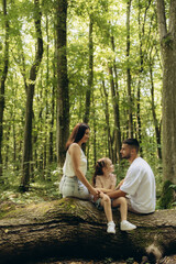 Happy Family Spending Time Together in a Peaceful Forest Setting