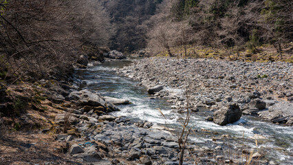 The clear stream flowing through the quiet valley in Chichibu City, Saitama Prefecture, Japan