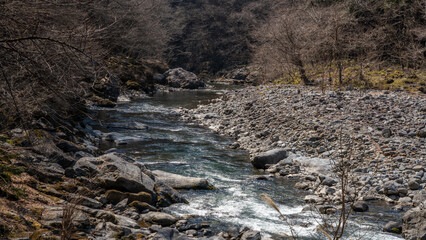 The clear stream flowing through the quiet valley in Chichibu City, Saitama Prefecture, Japan