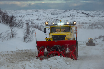 A snowplow on the Murmansk-Teriberka highway on a winter day. Arctic, Kola Peninsula
