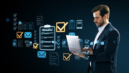 Businessman using laptop with holographic digital document management system.