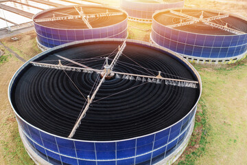 Aerial view large circular biofilter tanks at wastewater treatment plant. Industrial facility using...