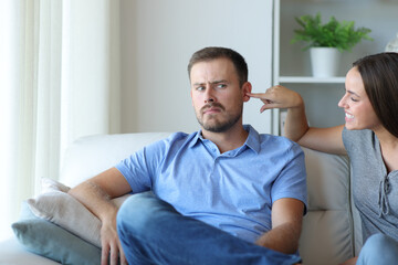 Woman pestering her partner or friend at home