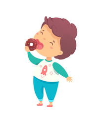 A young child with curly hair happily eats a chocolate donut while wearing a playful shirt and pants at home. The atmosphere is cheerful and relaxed, perfect for a sweet treat.