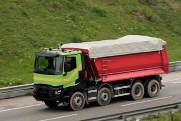 Heavy Duty Tipper Truck with Covered Load on Transport Route