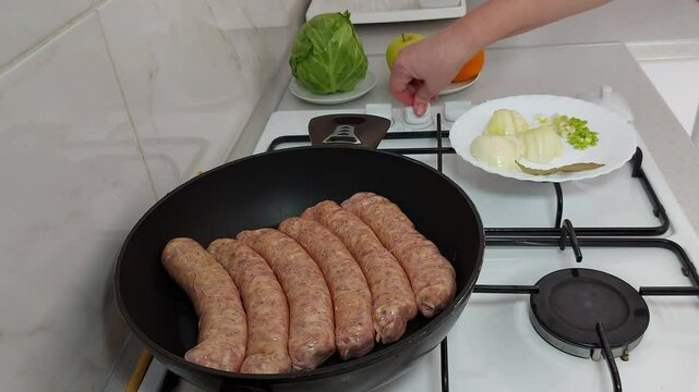 Frying Perfection: Sausages Ready for Crispy Bliss