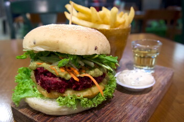 beetroot and avocado hamburger and fries