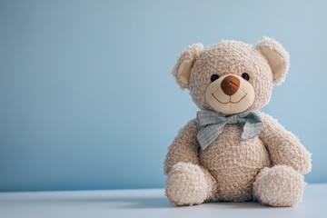 Obraz premium A cute teddy bear with a blue bow tie on display