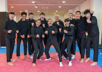 Judo school group training in Madrid with enthusiastic participants indoors