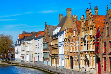 Naklejka premium Panorama with canal and colorful traditional houses in Bruges, Belguim
