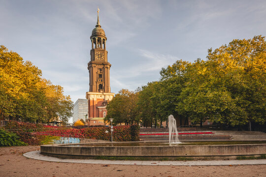 Church St. Michaelis in Hamburg during autumn with a fountain in the foreground