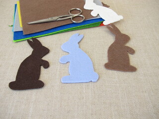 Colorful craft felt and cut out Easter bunnies