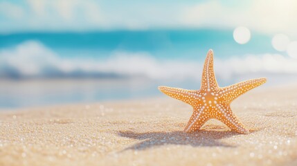 Starfish on sand beach with ocean on background. Marine and seaside vacation concept. Image for banner, invitation, greeting card with copy space.