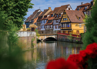 Obraz premium Half timbered houses by canals of Petite France in Strasbourg, France at sunset