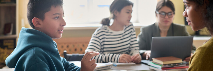 Students engaged in discussion in a classroom setting