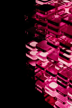 Layers of microchip blocks with illuminated pink light in dark