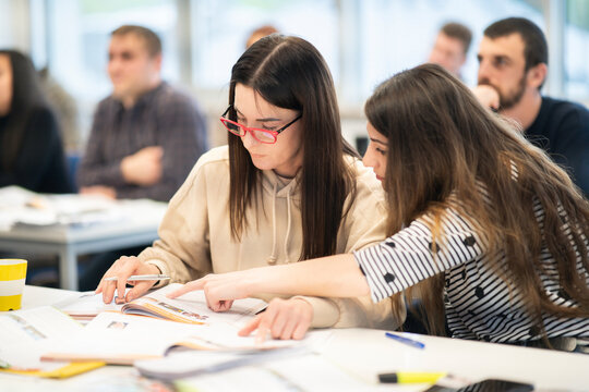 Students collaborating in a multicultural learning environment during an international language course