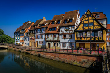 Fototapeta premium Half timbered houses by canals of Little Venice in Colmar, France