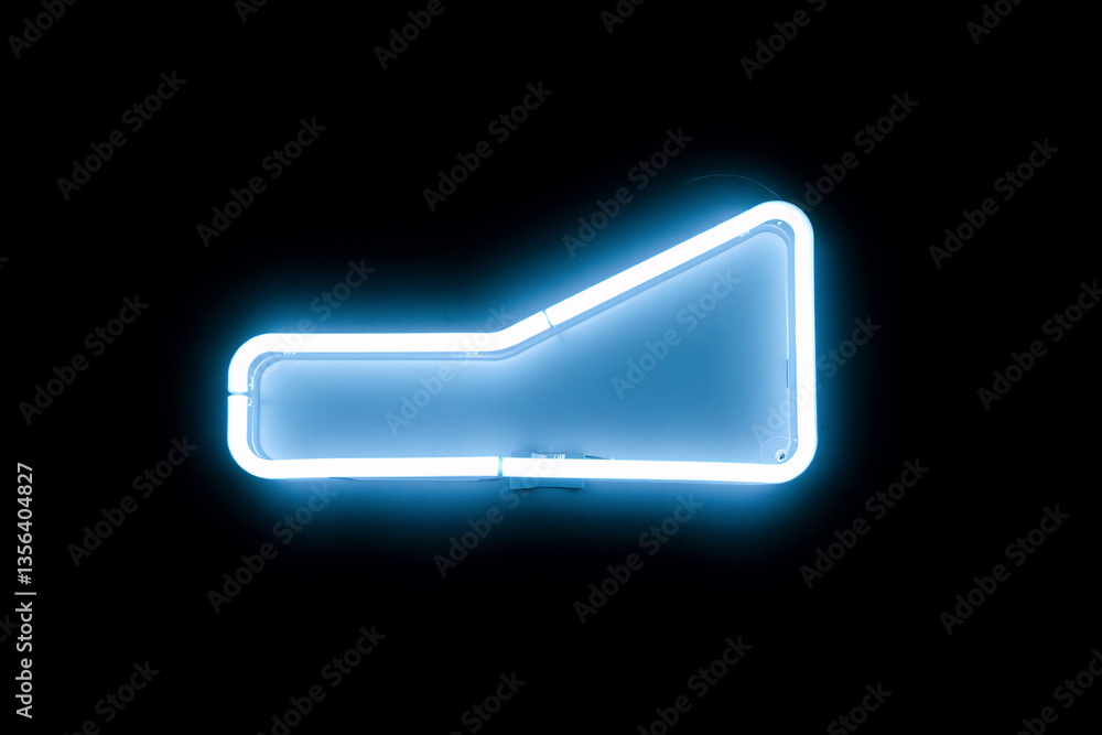 Fototapete A glowing blue neon abstract shape with rounded corners and geometric form is illuminated on a stark black background. Bright light creates a sharp contrast.
